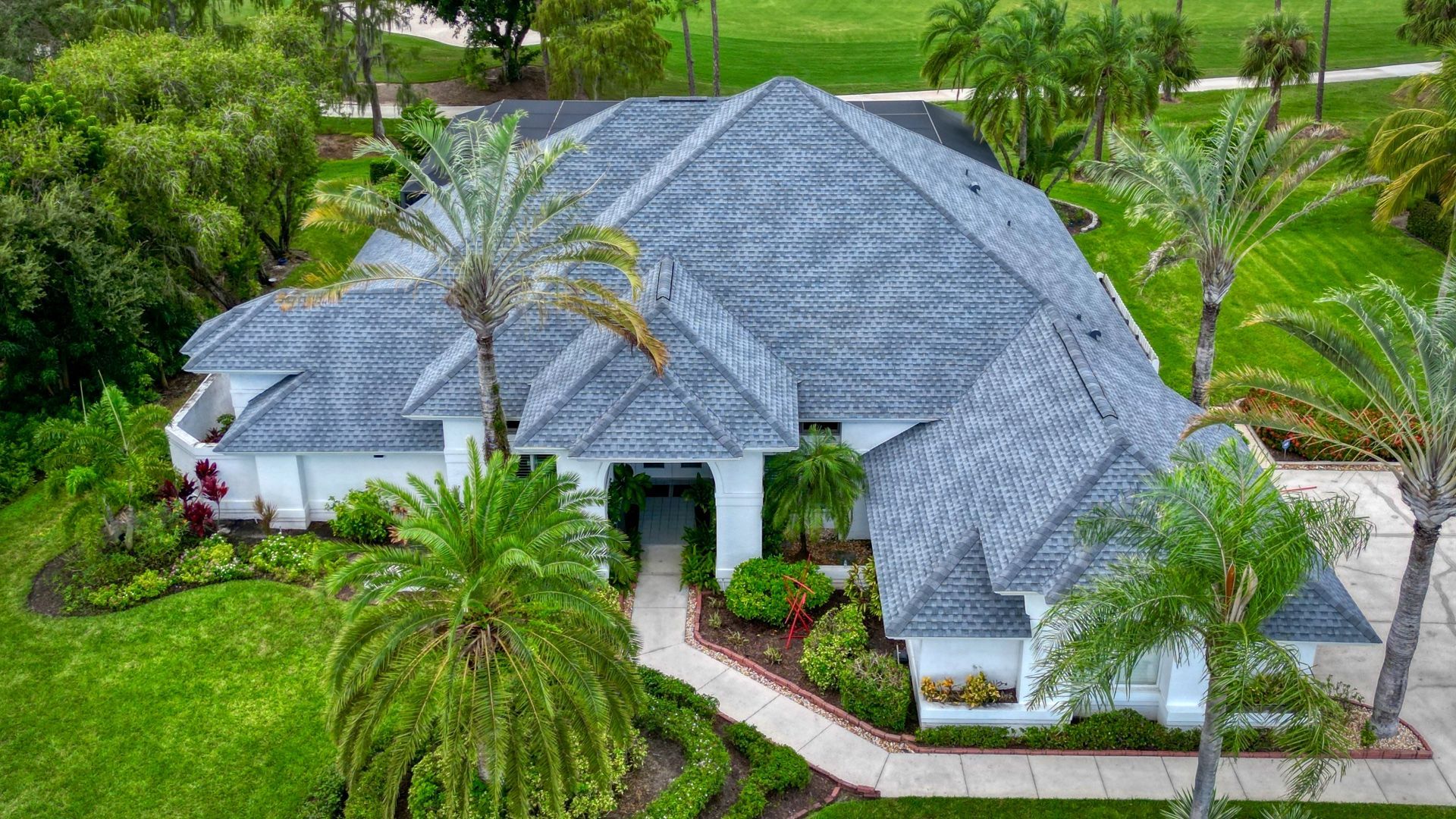 Oyster Grey GAF HDZ Timberline Shingle roof by Polaris Roofing in Estero Florida. Durable, high-quality, and aesthetically pleasing.