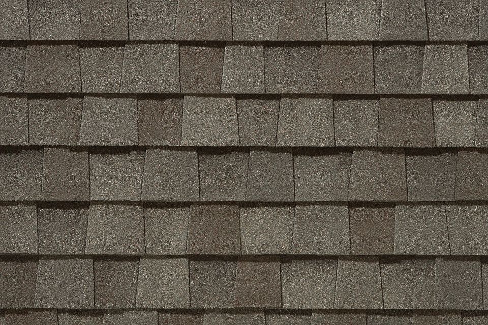 A close up of a roof with shingles on it.