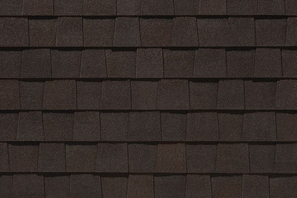 A close up of a brown shingle roof.