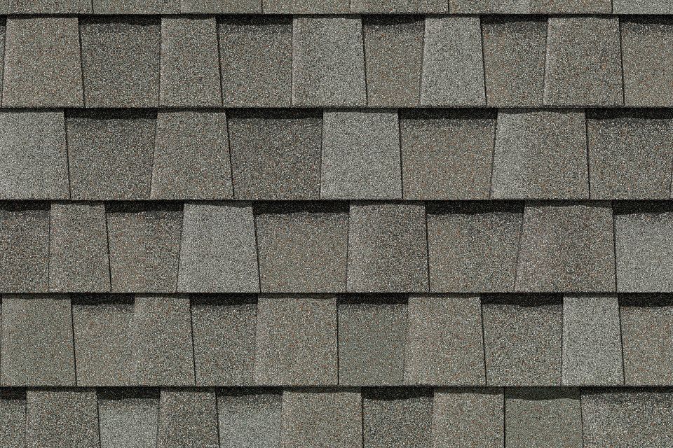 A close up of a roof with shingles on it.