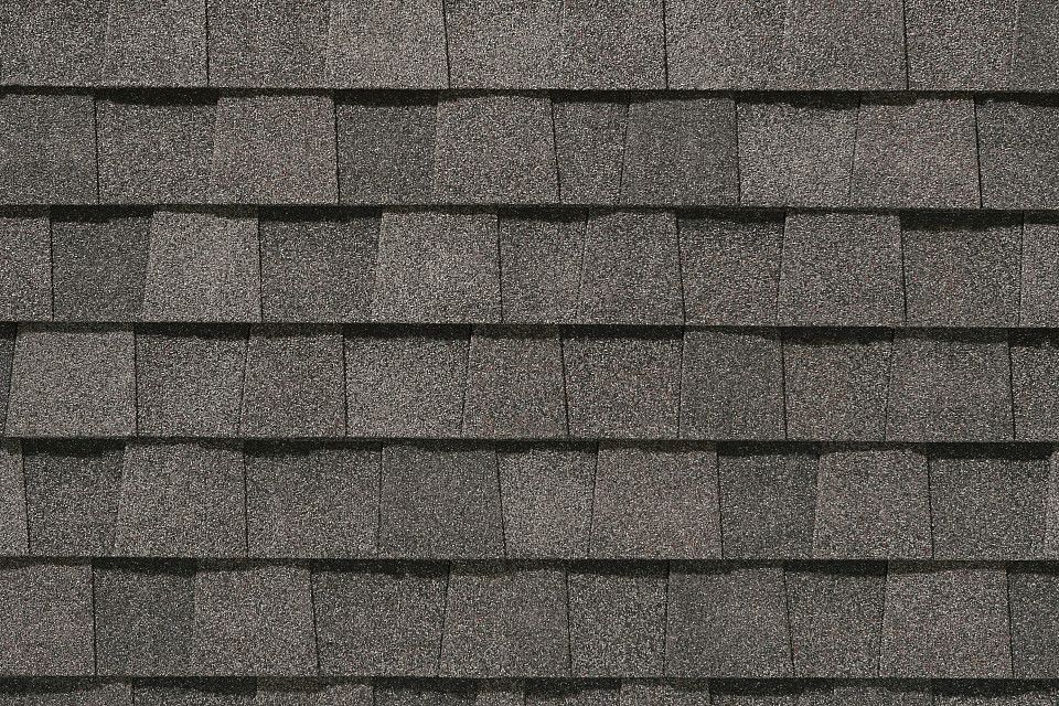A close up of a roof with shingles on it.