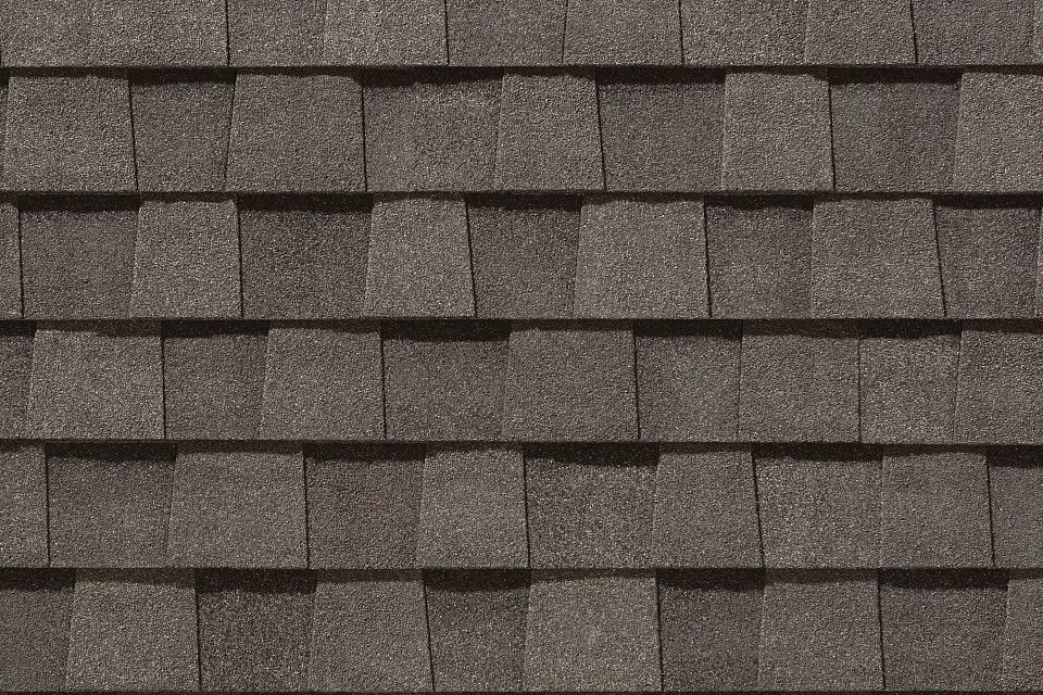 A close up of a roof with shingles on it.