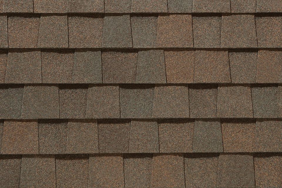 A close up of a roof with shingles on it.