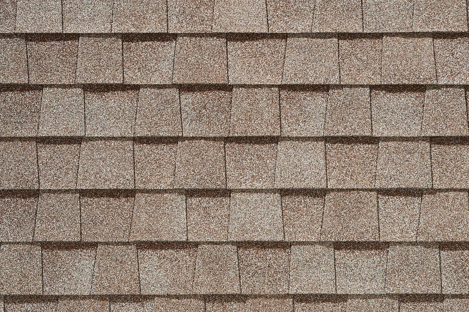 A close up of a roof with shingles on it.