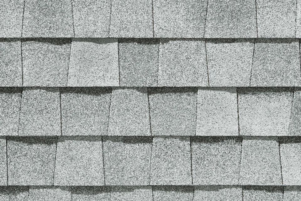 A close up of a roof with shingles on it.