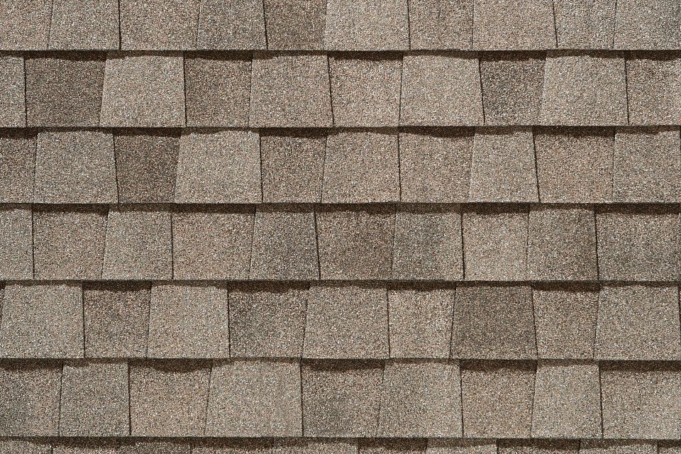 A close up of a roof with shingles on it.