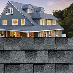 Gray house with dormers, new gray asphalt shingles.