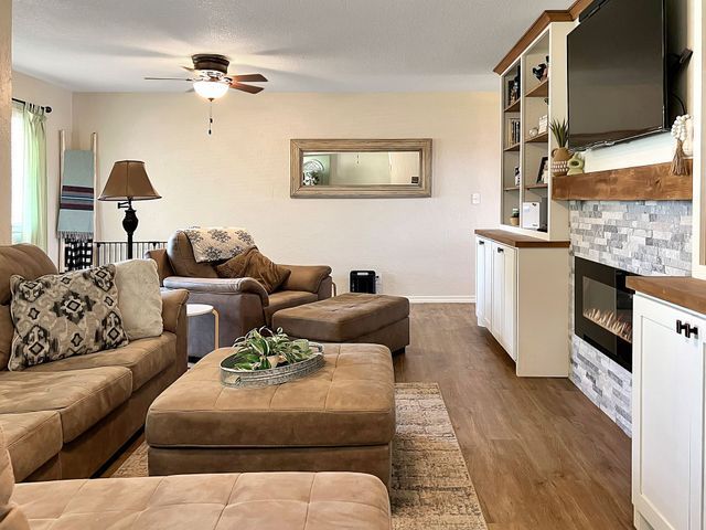 A living room filled with furniture and a fireplace.