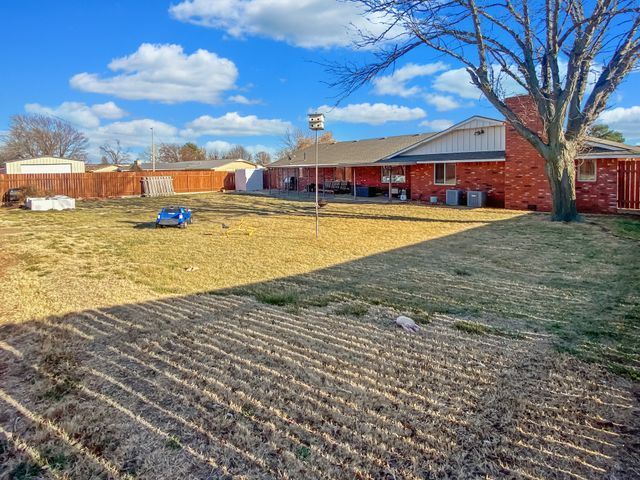 A house with a lot of grass in front of it