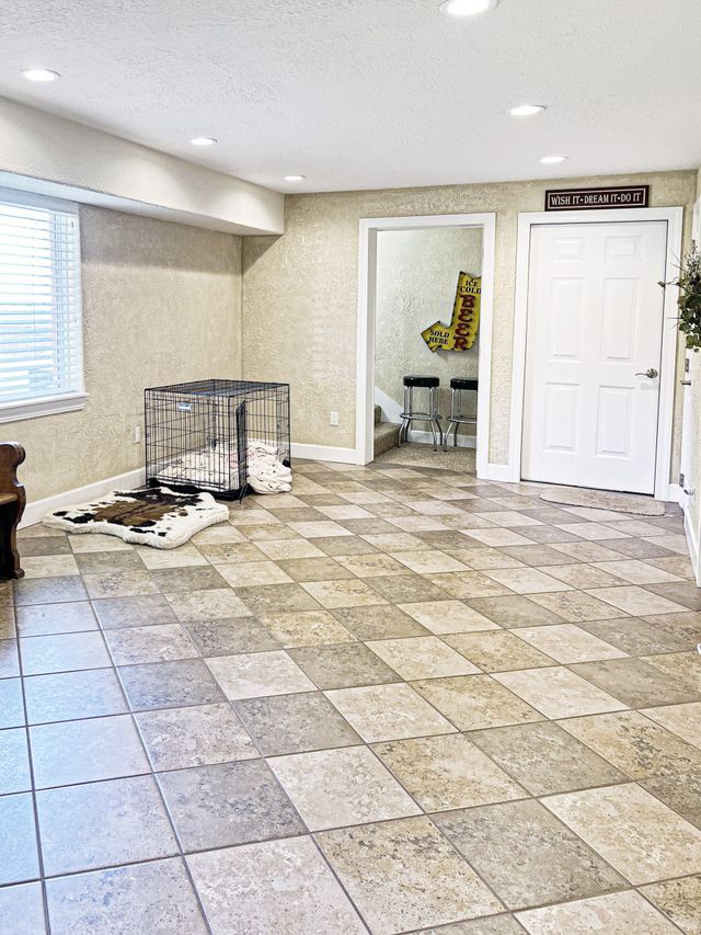 There is a dog cage in the middle of the room.