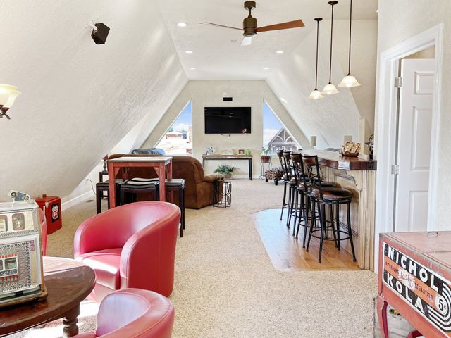 A living room with red chairs and a kitchenaid machine