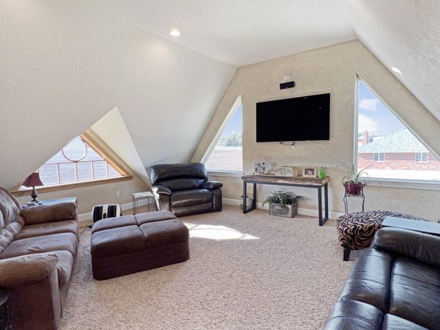 A living room filled with furniture and a flat screen tv