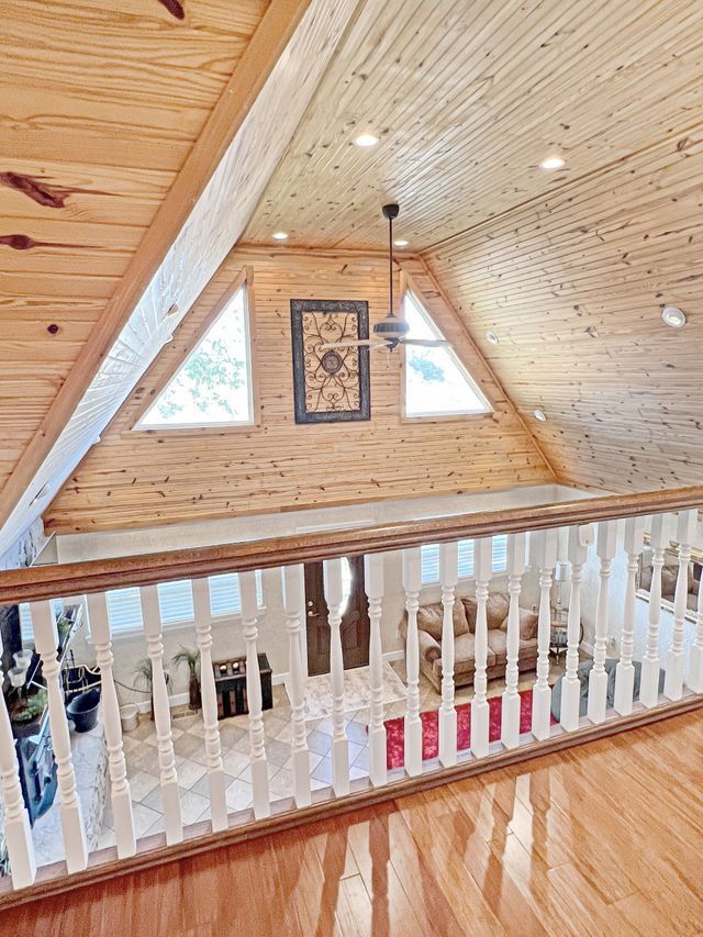 There is a ceiling fan in the corner of the room.