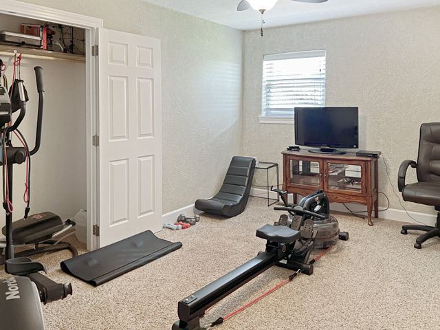 There is a rowing machine in the middle of the room.