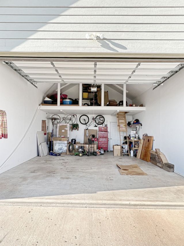 A garage filled with lots of tools and boxes.