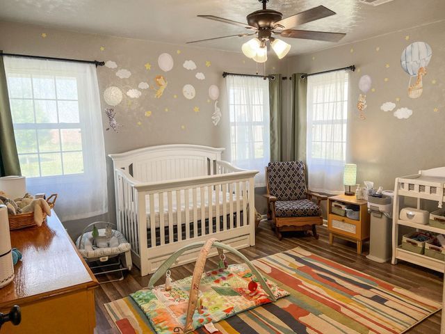 There is a crib in the middle of the room.