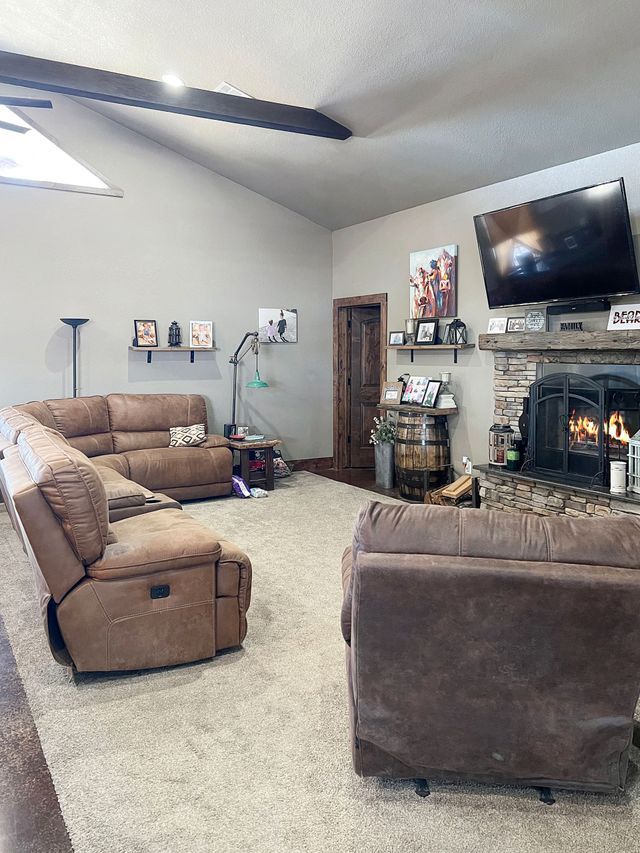 A living room filled with furniture and a fireplace.