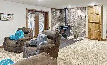 A living room filled with furniture and a fireplace.