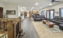 A living room filled with furniture and a ceiling fan.