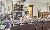A living room filled with furniture and a fireplace.