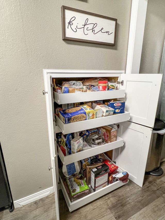 A pantry filled with lots of food in a kitchen.