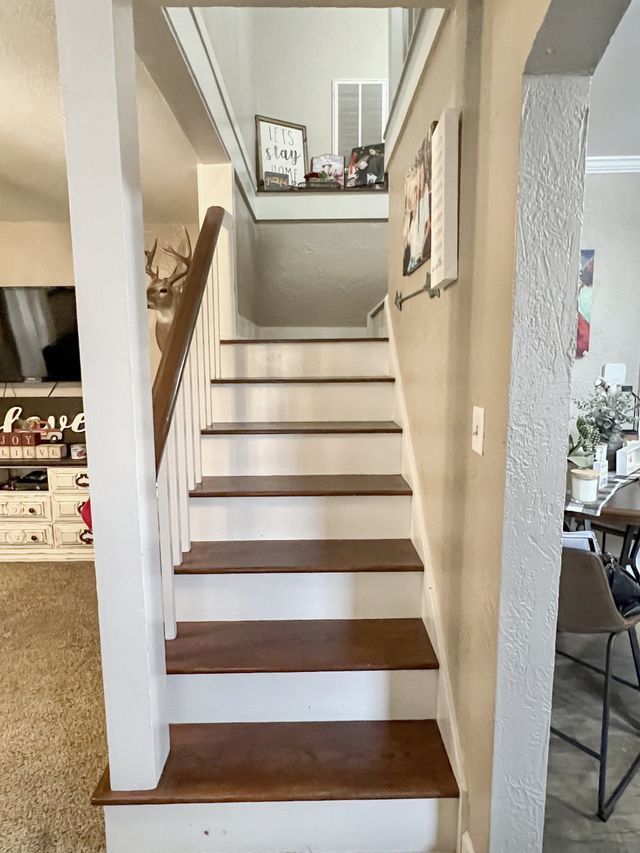 A set of stairs leading up to the second floor of a house.