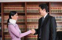 A lawyer shaking hands with his client