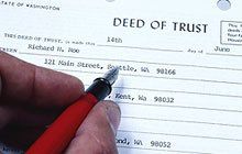 A man filling up Deed of Trust form