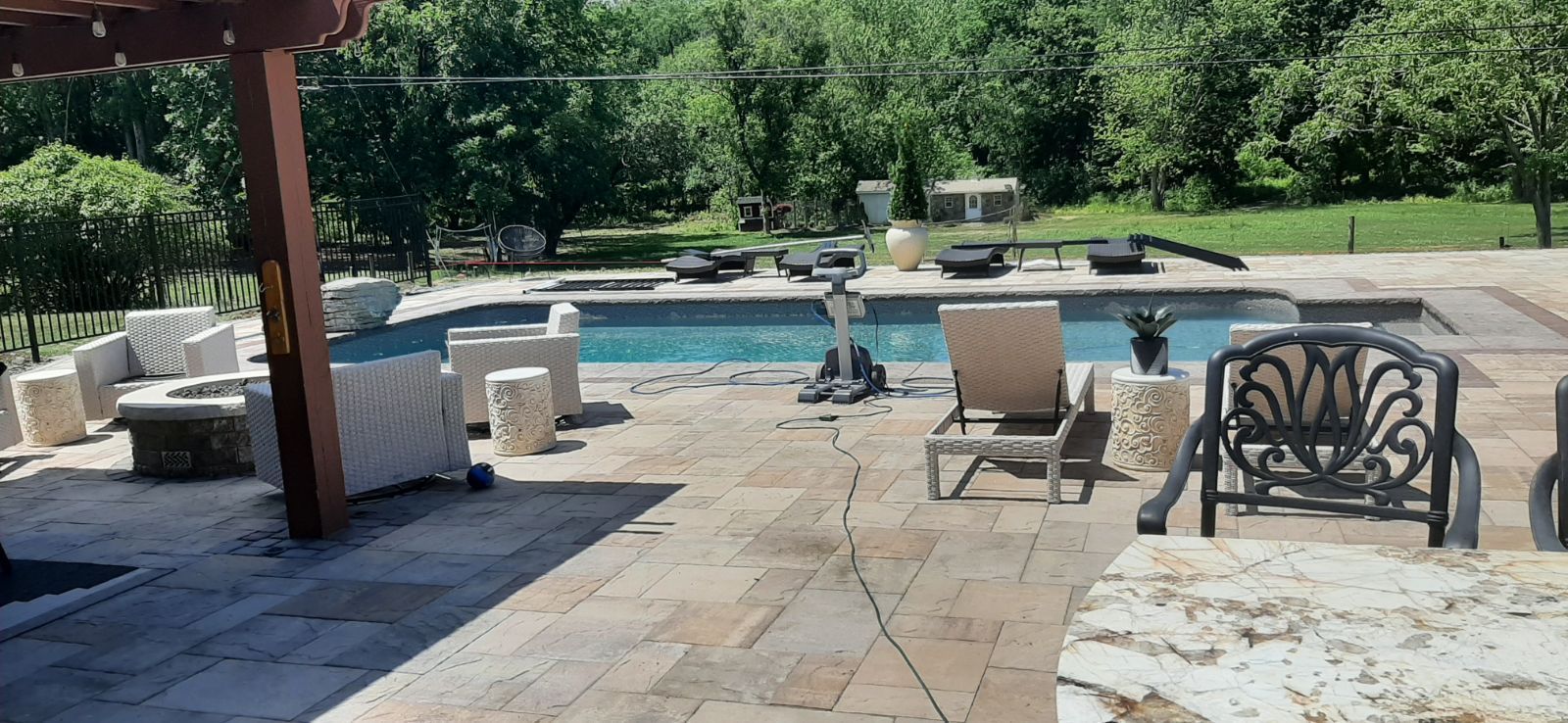 A large patio with a swimming pool