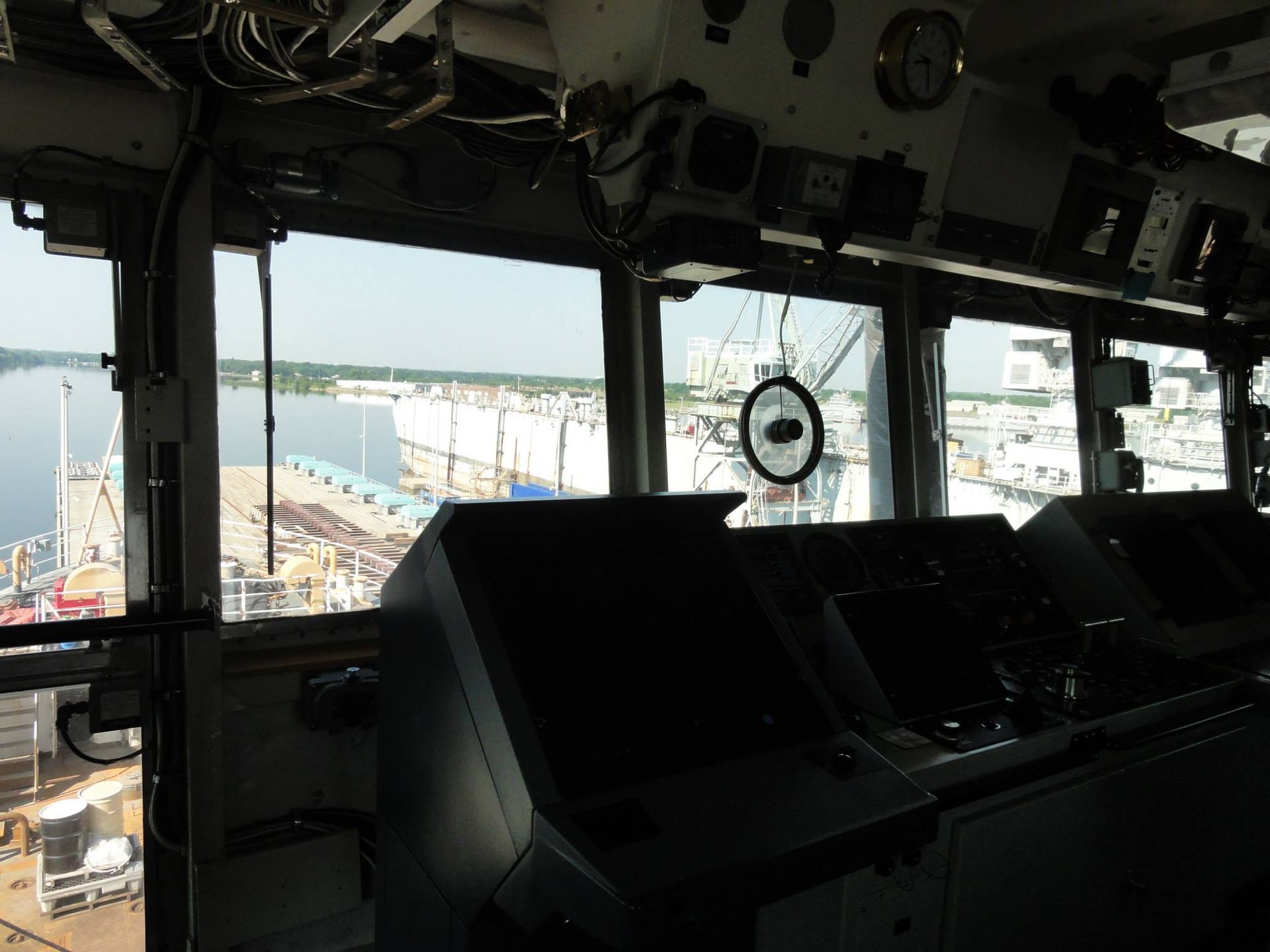 The inside of a ship with a view of the water