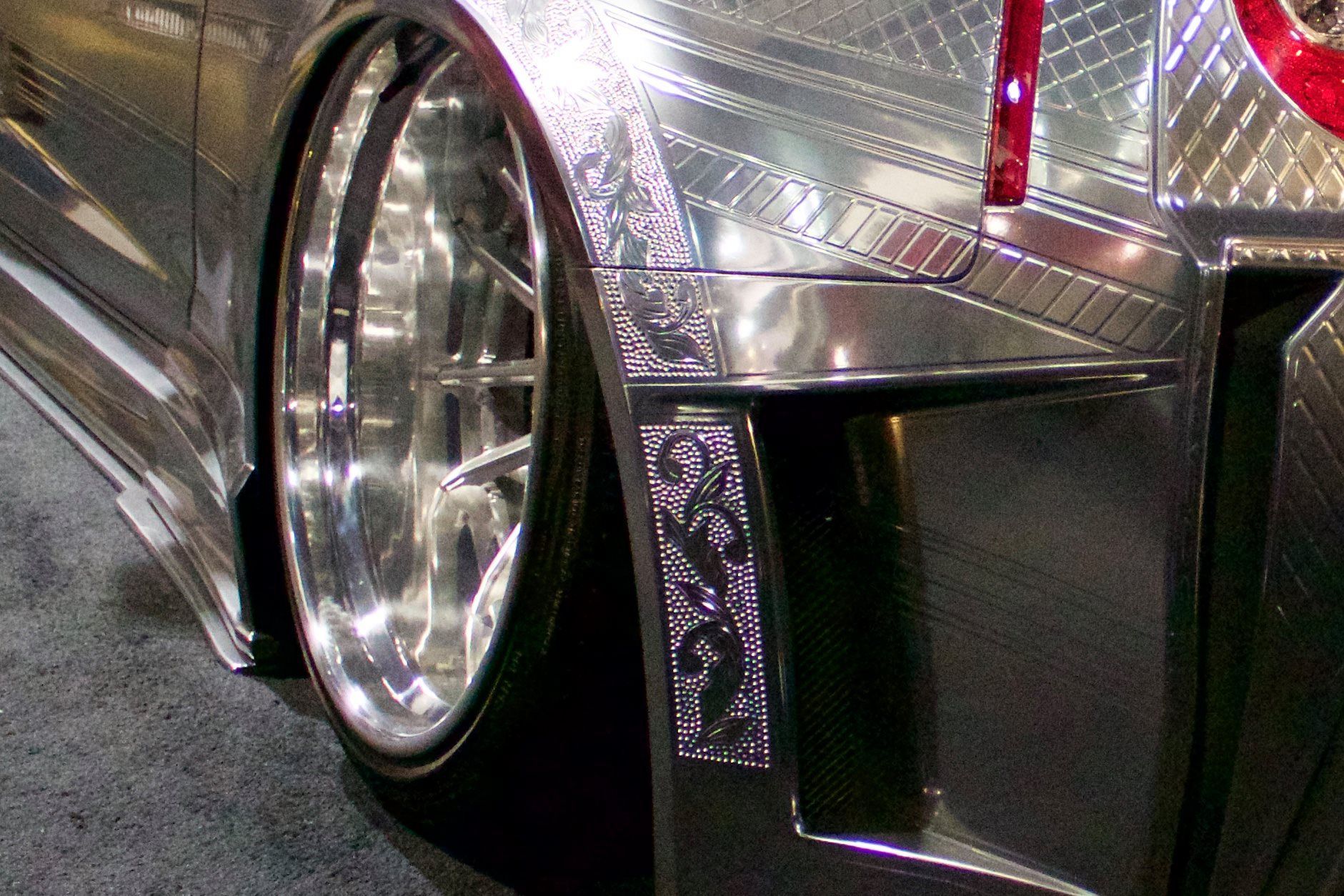 A close up of a car 's wheel and fender