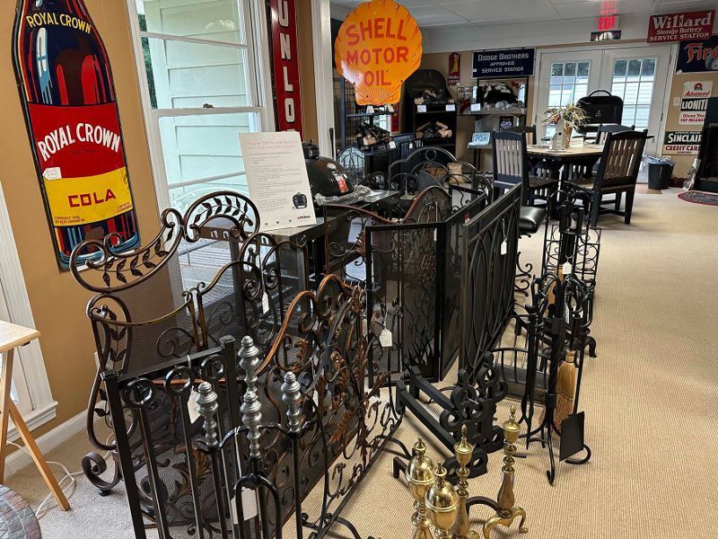 A room with a sign that says shell motor oil on it.