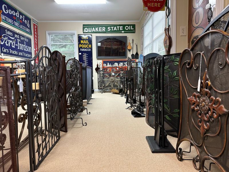 A room filled with lots of wrought iron fences and a sign that says quaker state oil