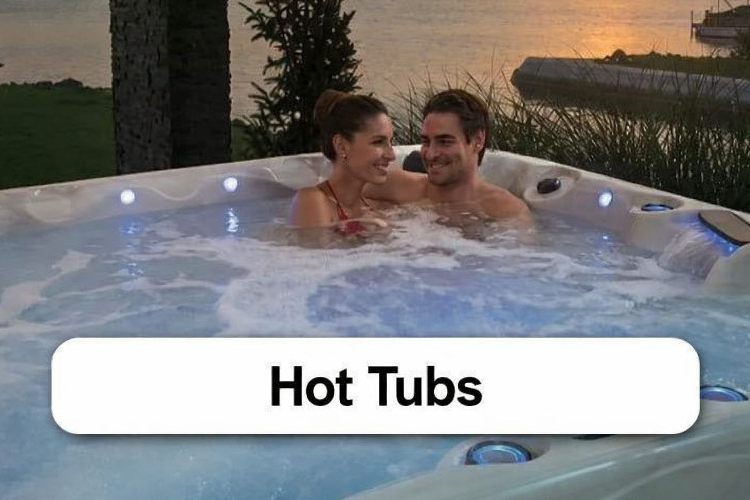 A man and a woman are sitting in a hot tub with the word spas above them