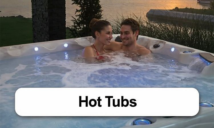 A man and a woman are sitting in a hot tub with the word spas above them