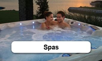 A man and a woman are sitting in a hot tub with the word spas above them