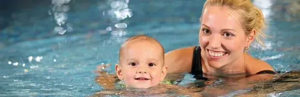 Mother and baby in pool