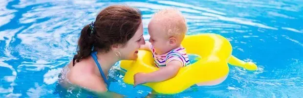 Mother and baby in pool