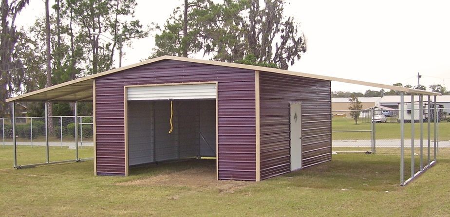A purple garage with a white door is in a grassy field