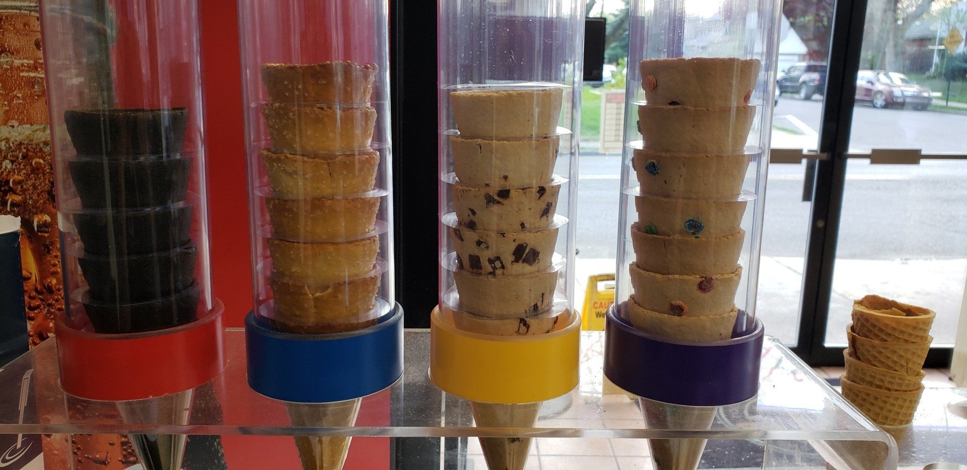 A row of ice cream cones sitting on top of a table.