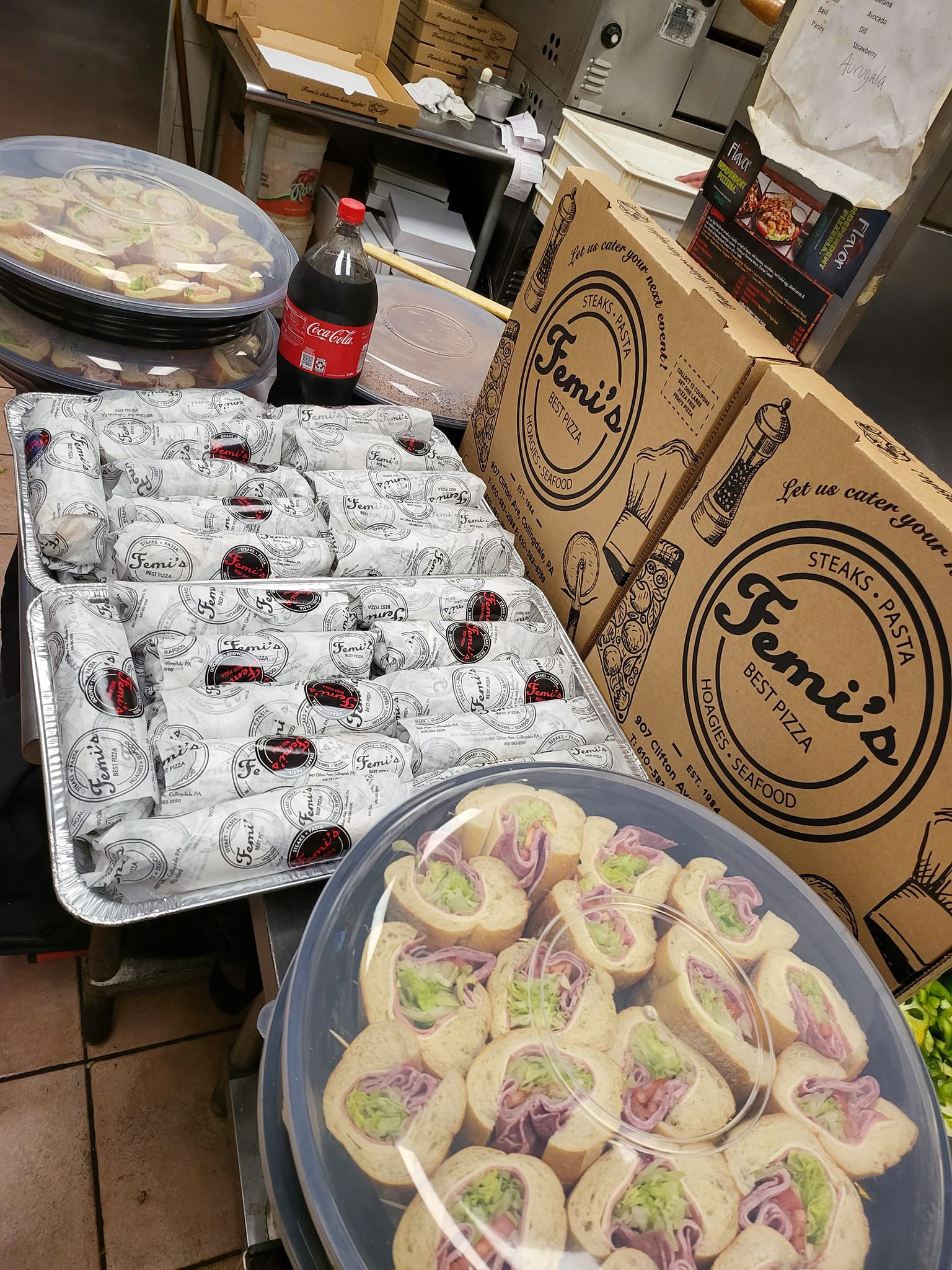 A bunch of food is sitting on a table in a restaurant.