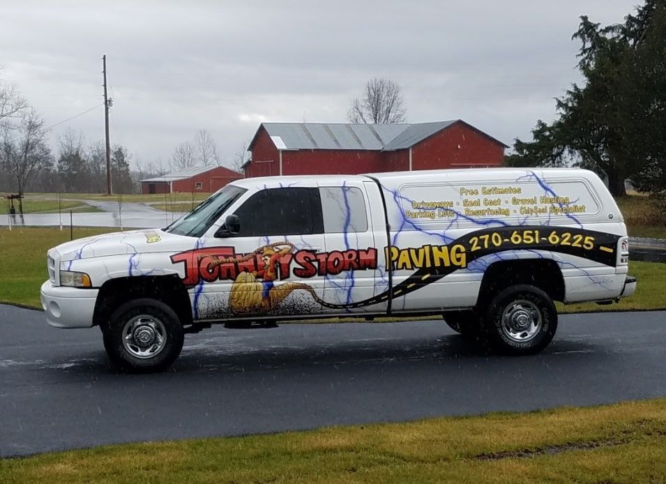 White pickup truck with company logo 