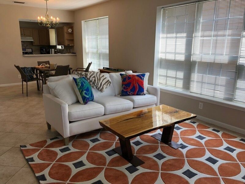 A living room with a couch and a coffee table