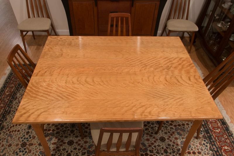 A wooden table and chairs in a living room