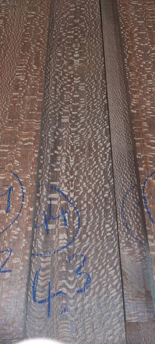 A close up of a piece of wood with graffiti on it.