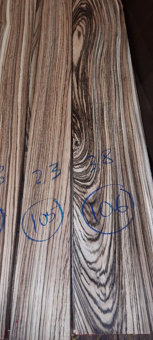 A close up of a painting on a wooden wall.