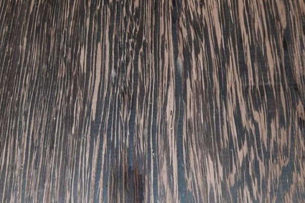 A close up of a piece of wood with a striped pattern.