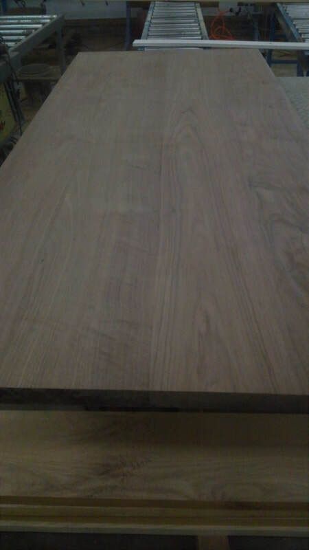 A large piece of wood is sitting on top of a table.