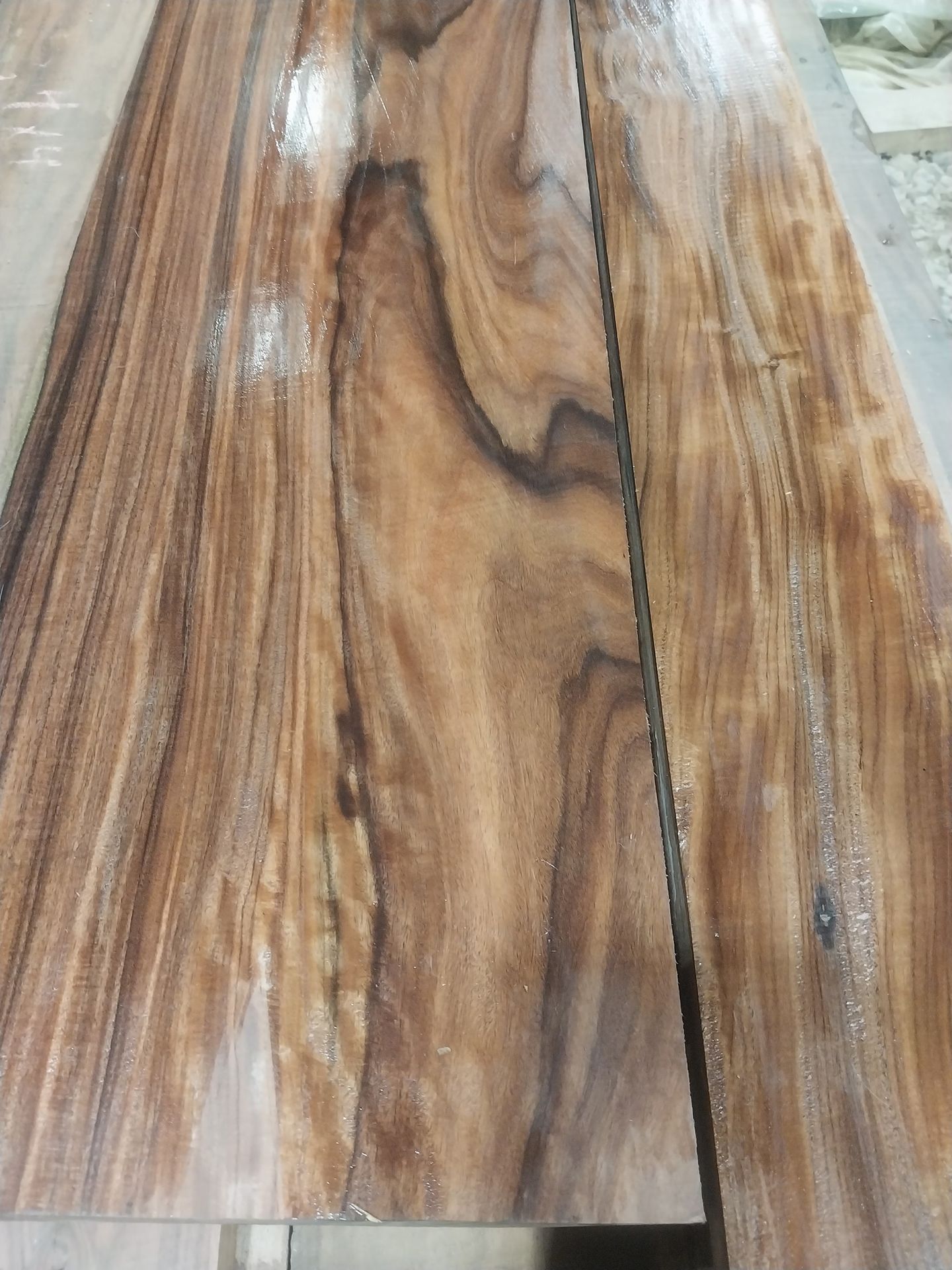 A close up of a wooden floor with a few lines on it