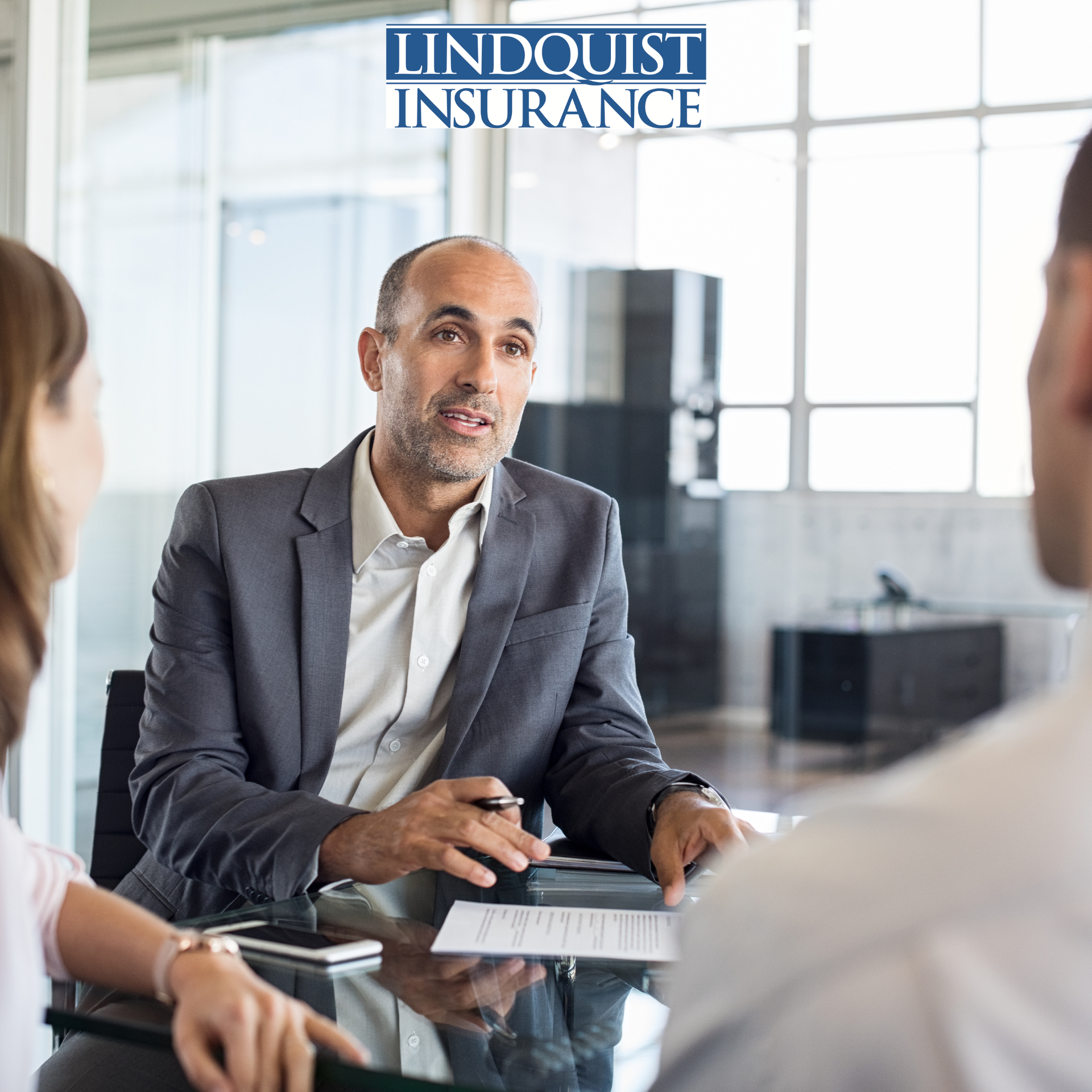 Insurance Agent reviewing a policy with a couple